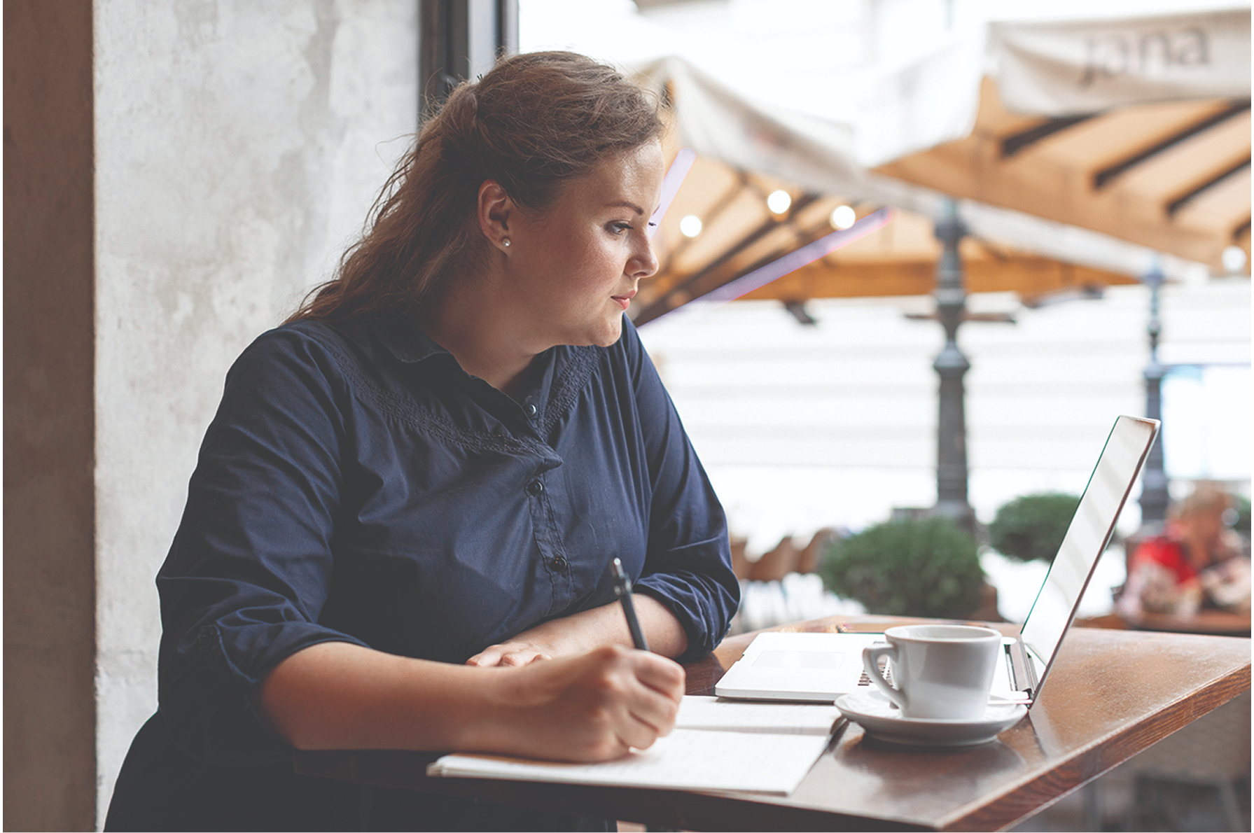 woman researching on laptop